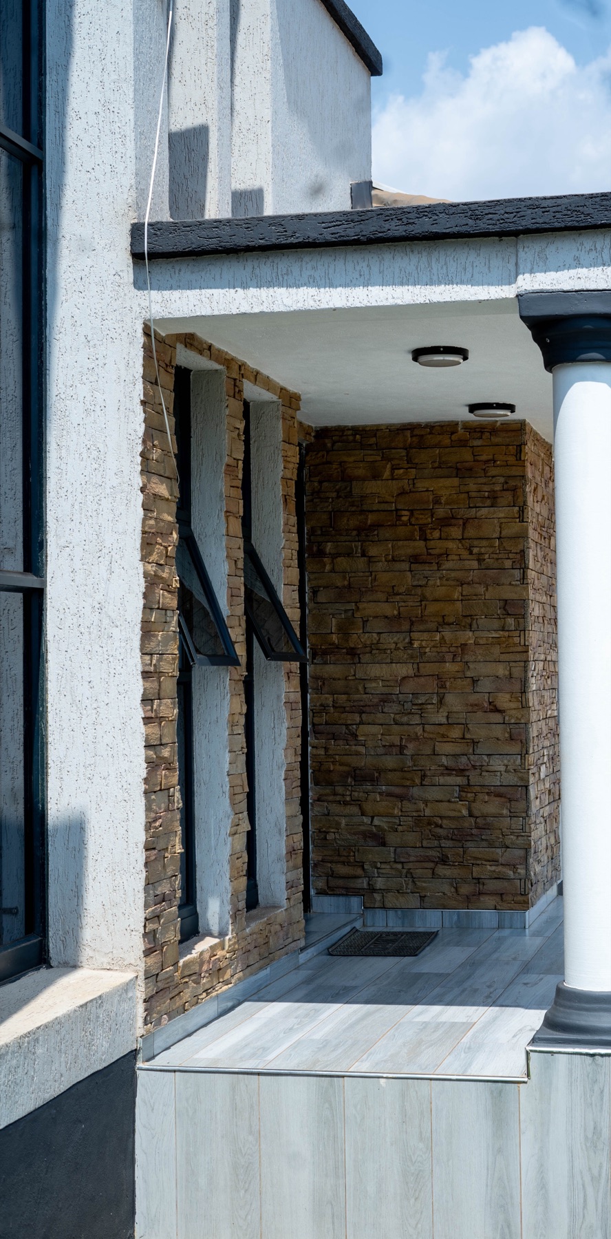Covered porch and column detail at Nichi Guesthouses