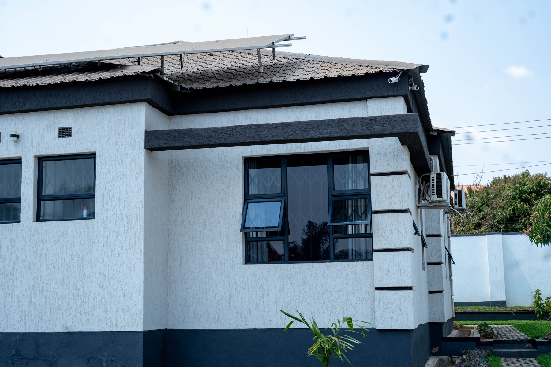 Roofline of Nichi Guesthouses with solar panels
