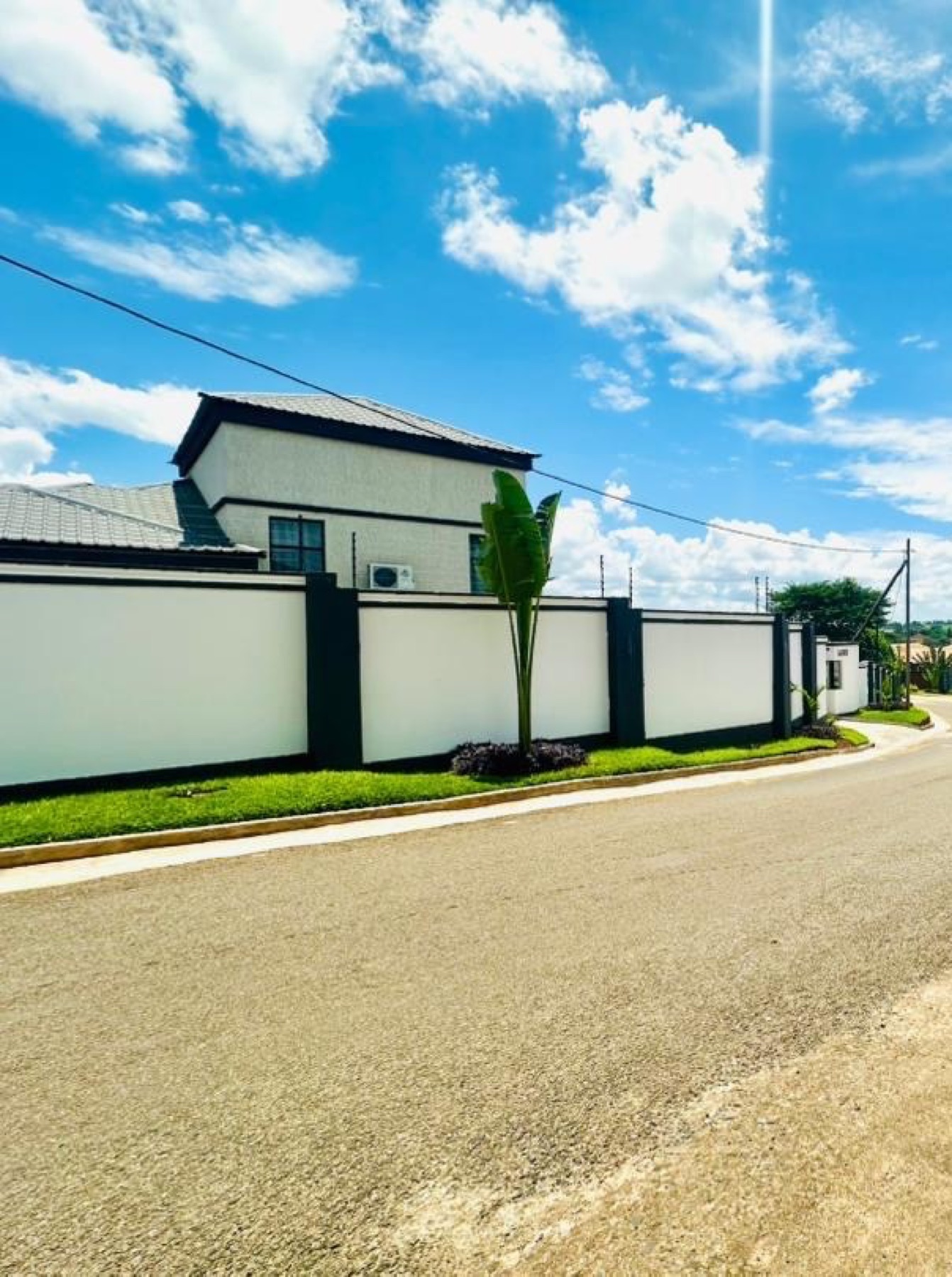 Street view of Nichi Guesthouses along the boundary wall